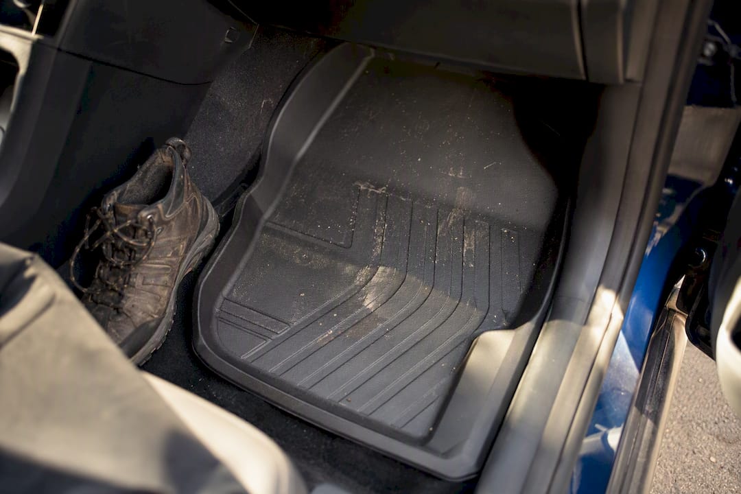 Close-up of custom TPE car floor mats installed