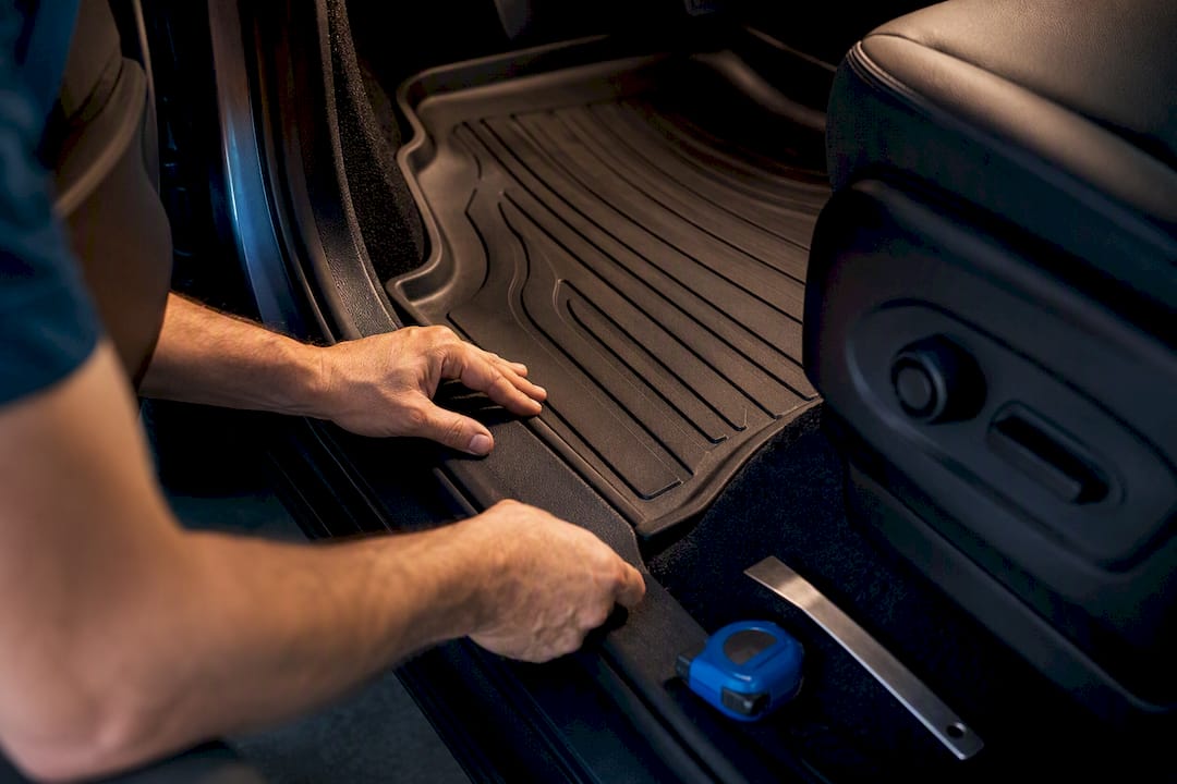 Hands checking custom liner floor fit
