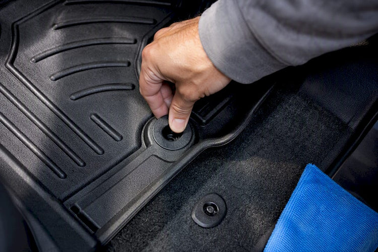 Hand checking floor mat anchor fit