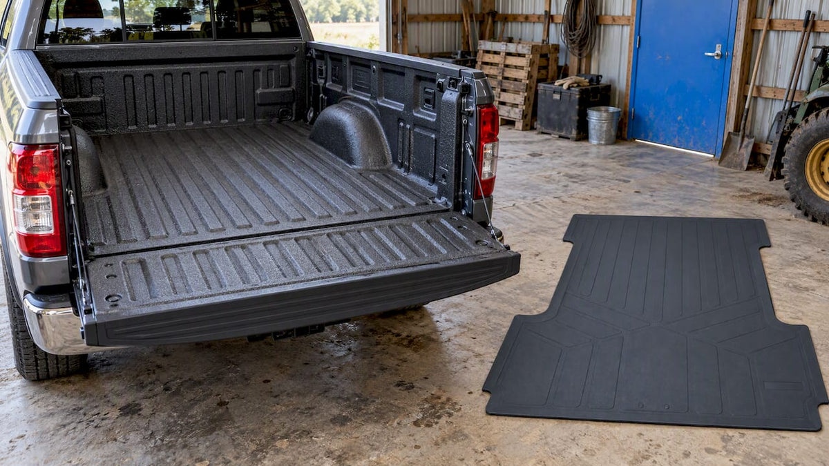 Truck bed mat beside a spray-coated pickup bed