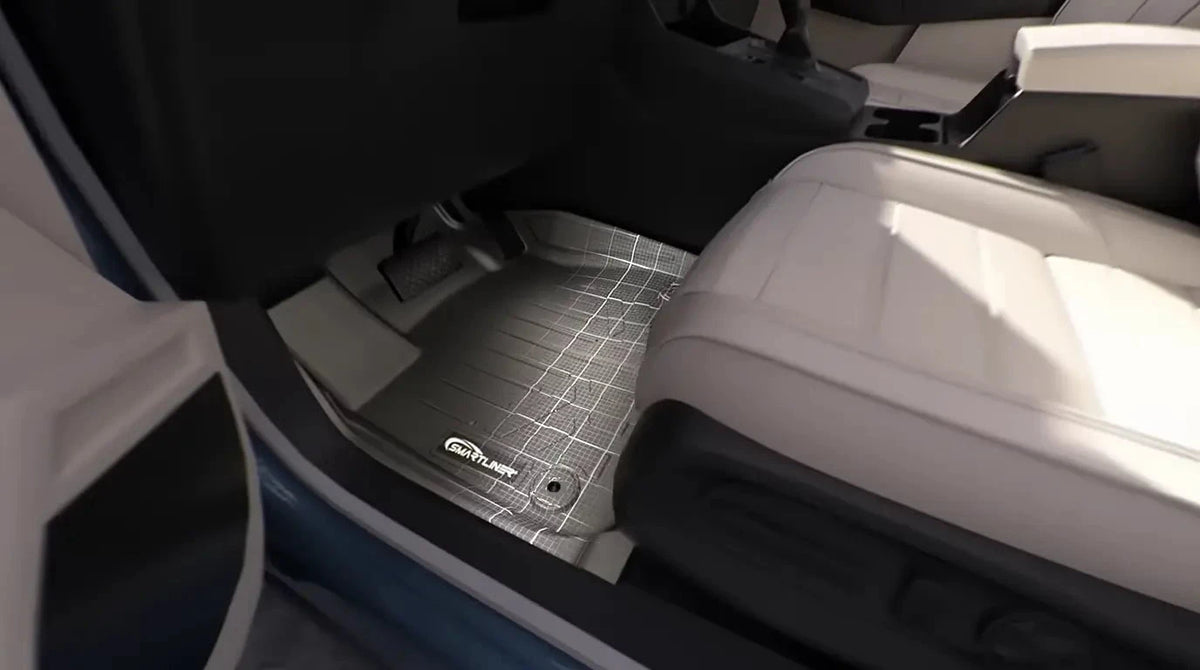 Laser 3D-scanned SmartLiner custom-fit floor mat installed in a vehicle footwell for a precise, factory-matched fit
